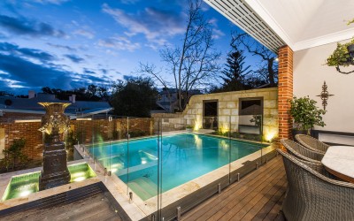 Notice the mirrors set into the limestone wall at the back of the pool.